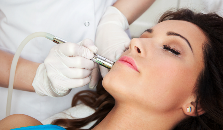 a lady improving the look of her face skin with an aesthetic laser treatment