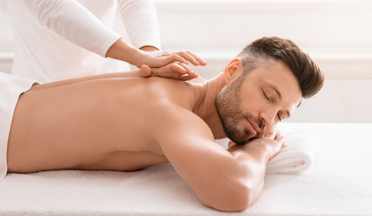 A man receives a full-body massage